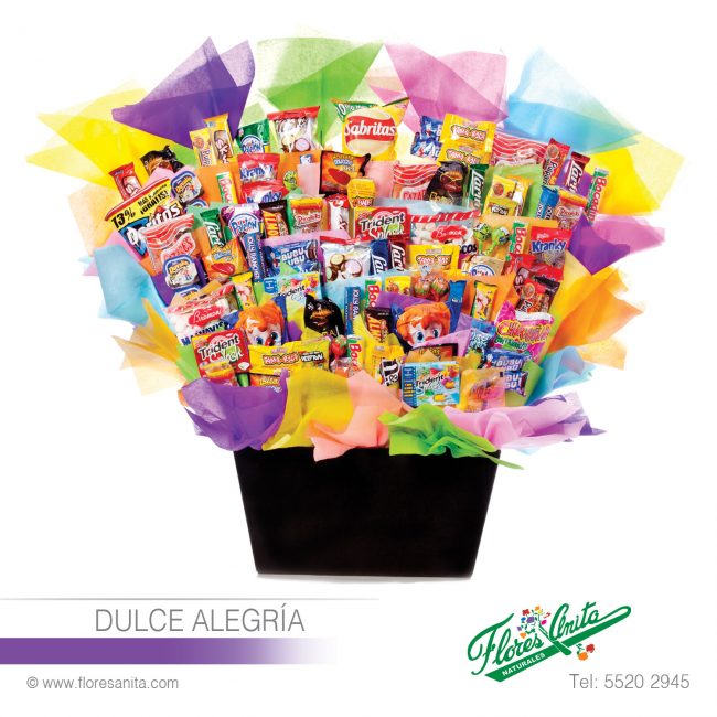 DULCE ALEGRÍA (Arreglo Dulces) Dulces Arreglo de Dulces varios que incluye chocolates, tamarindos, papas, chicles y caramelos, adornado con papel de china, en base de madera color chocolate.